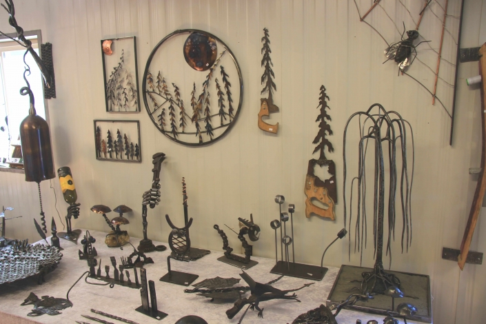 Table and wall full of metal art