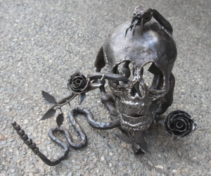 Skull and snake sculpture